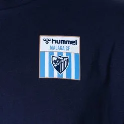 Camiseta Hummel Málaga CF Fanswear 2022-2023 Niño 8 Camiseta Hummel Málaga CF Fanswear 2022-2023 Niño -tienda de material de futbol camiseta hummel malaga cf fanswear 2022 2023 nino marine 2